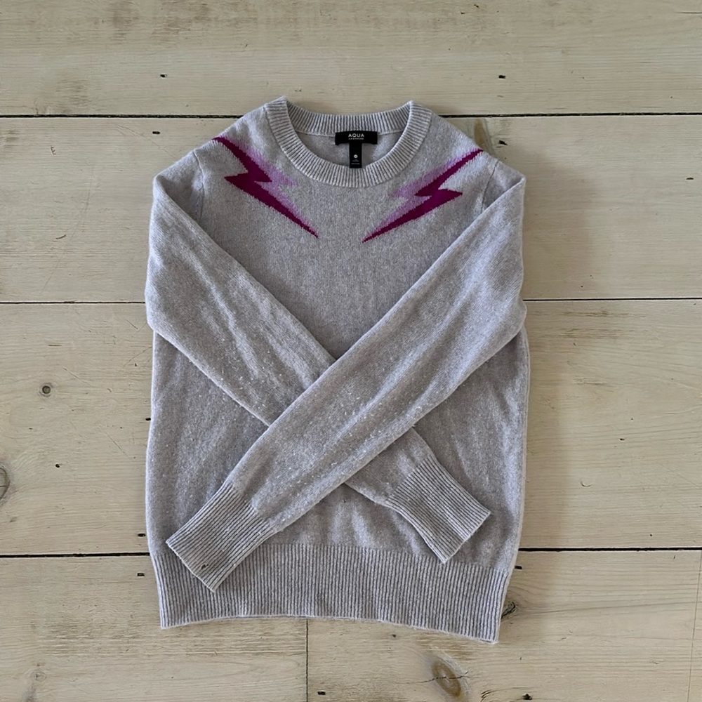 Aqua cashmere lightening bolt sweater. Size XS. A couple of small holes